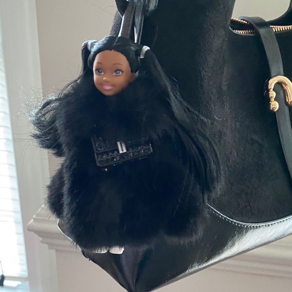 Doll  Keychain , bag charm wearing fluffy  fur coat , soft leather strep .